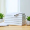 hospital flat sheets stacked